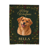 A personalized Christmas blanket featuring a golden retriever portrait with the name 'BELLA' and 'Merry Woofmas' text, set against a dark green holiday background with pine branches, red berries, and warm string lights.