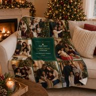A personalized Christmas photo blanket draped over a beige sofa in a cozy living room with a lit fireplace and decorated Christmas tree in the background. The blanket features a central dark green panel with the text 'OUR FIRST CHRISTMAS TOGETHER THE JOHNSON FAMILY 2026' surrounded by family photos.