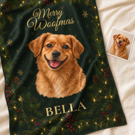 A personalized Christmas throw blanket featuring a golden retriever portrait, the text 'Merry Woofmas' and 'BELLA', and a dark green holiday background with pine branches, red berries, and warm string lights. A small printed photo of the dog is placed beside the blanket on a cream fabric surface.