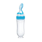 Clear baby bottle with blue accents on a white background